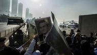 Des partisans de Hosni Moubarak brandissent des portraits du raïs, le 29 novembre 2014.